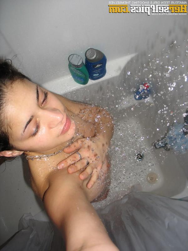 16P Cute teen showering showing her tight shaved young pink pussy