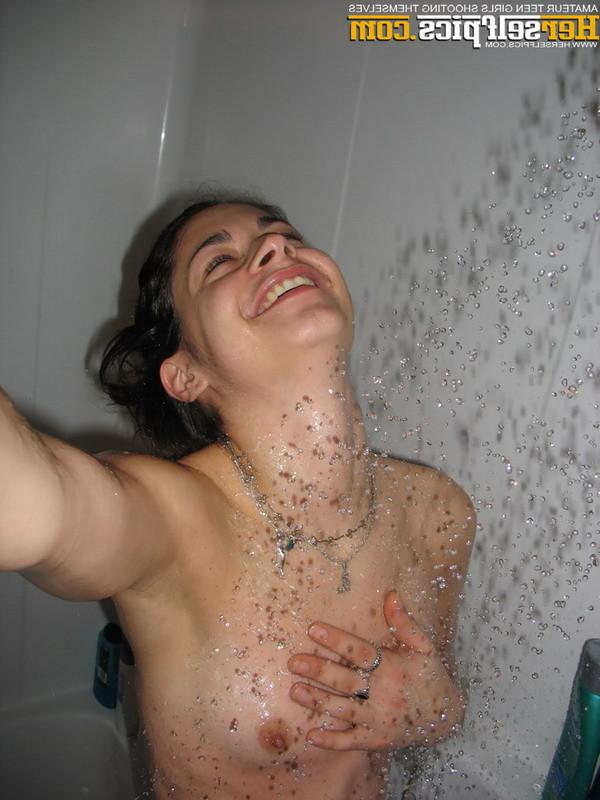 16P Cute teen showering showing her tight shaved young pink pussy