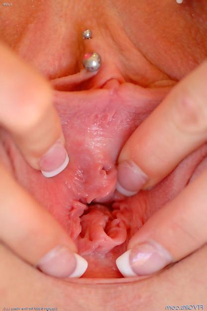 15P Blonde snatch shows off her pierced pink pussy