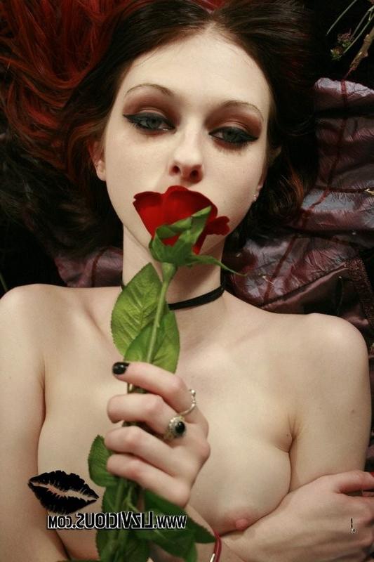 15P Emo punk chick with a flower shows off her pussy