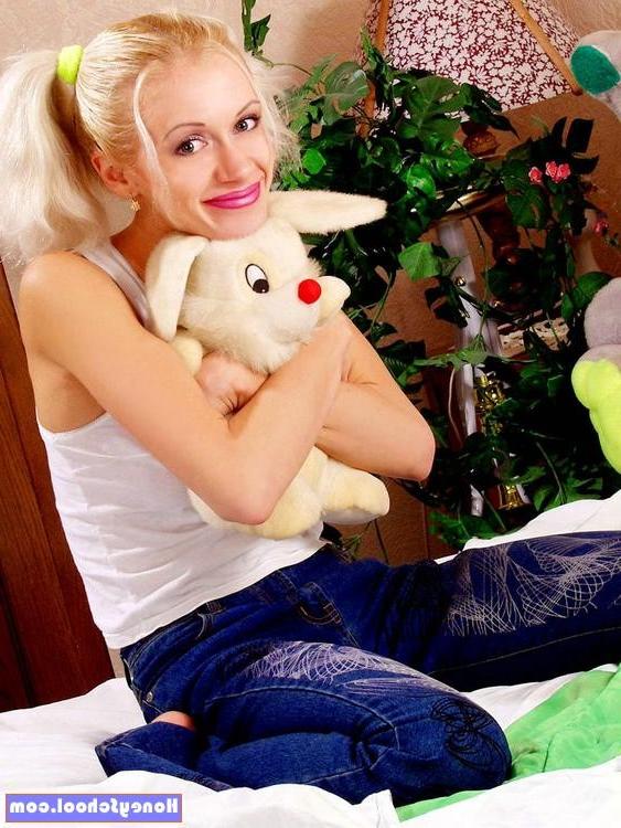 15P Pigtail blonde teen opens her legs to show her shaven pussy