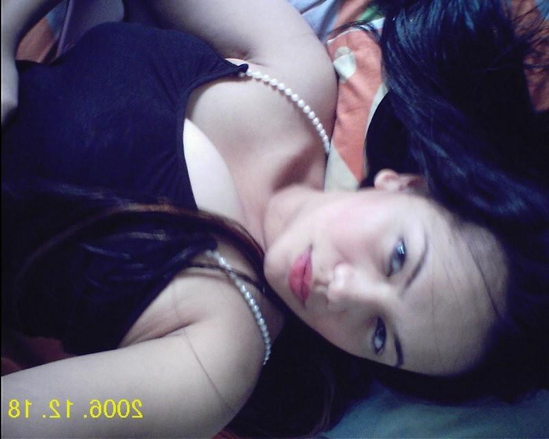 8P Cutie is great lying in sexy outfit before camera