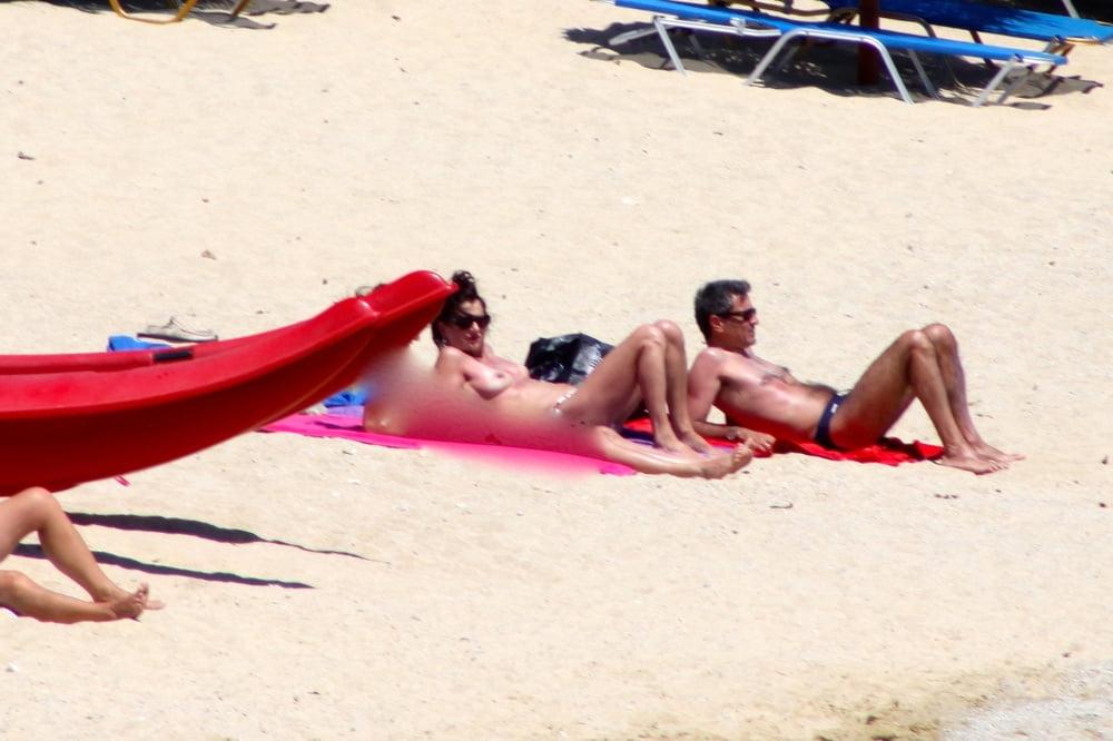 9P Italian mom white tits topless Mykonos beach