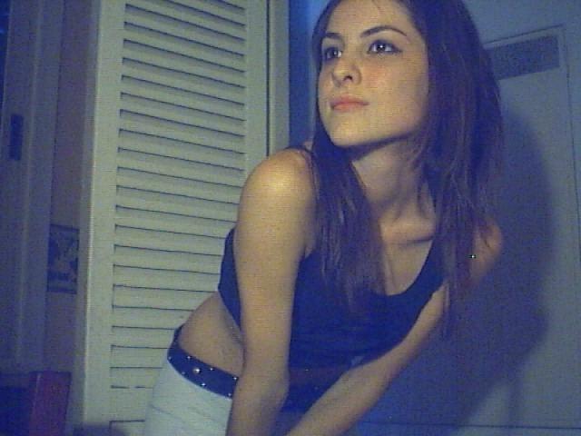 15P A brunette girl stripping