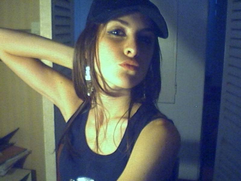 15P A brunette girl stripping