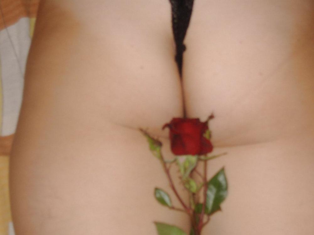 25P Brunette teen posing with a rose