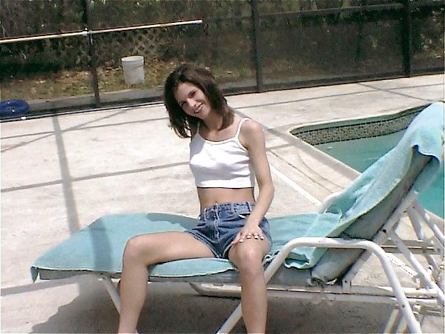 14P Brunette exposing herself by the pool