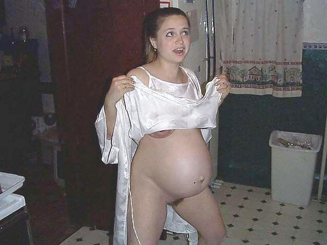25P Preggy blonde posing around the house