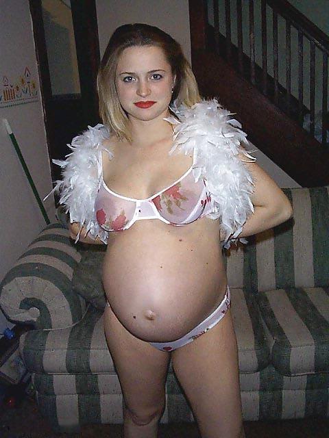 25P Preggy blonde posing around the house