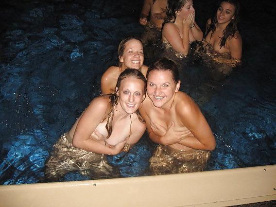 11P Naked girls playing in a pool by night