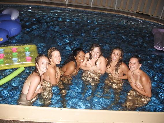 11P Naked girls playing in a pool by night
