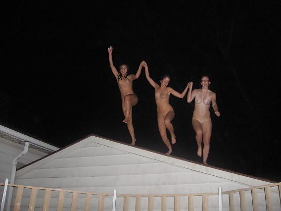 11P Naked girls playing in a pool by night