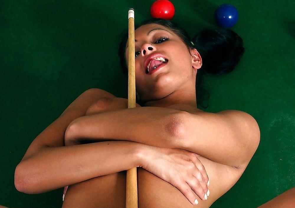 25P Brunette posing on a pool-table