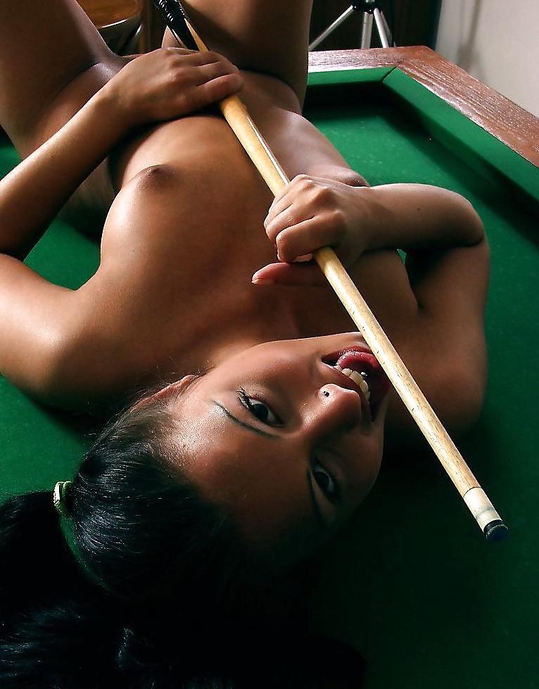 25P Brunette posing on a pool-table