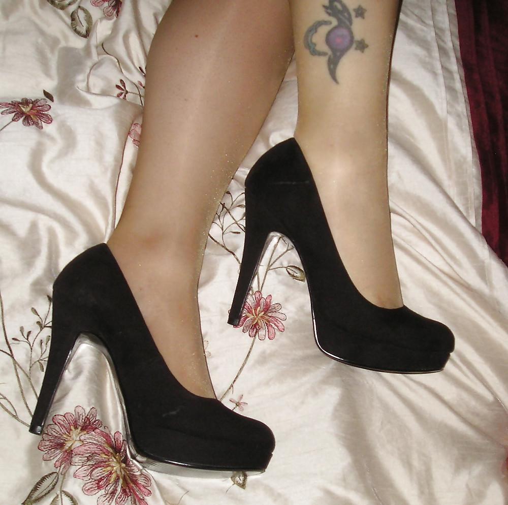 19P Tan tights and black heels