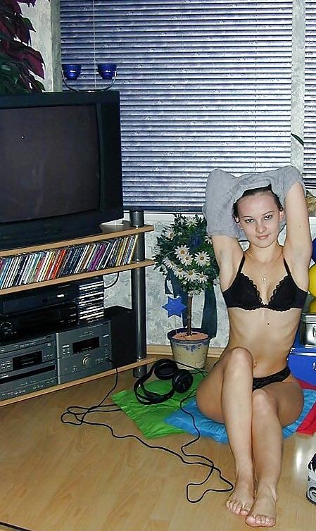 25P Brunette amateur Nadia posing around the house