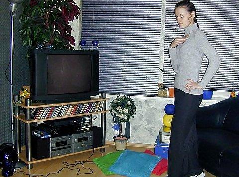 25P Brunette amateur Nadia posing around the house