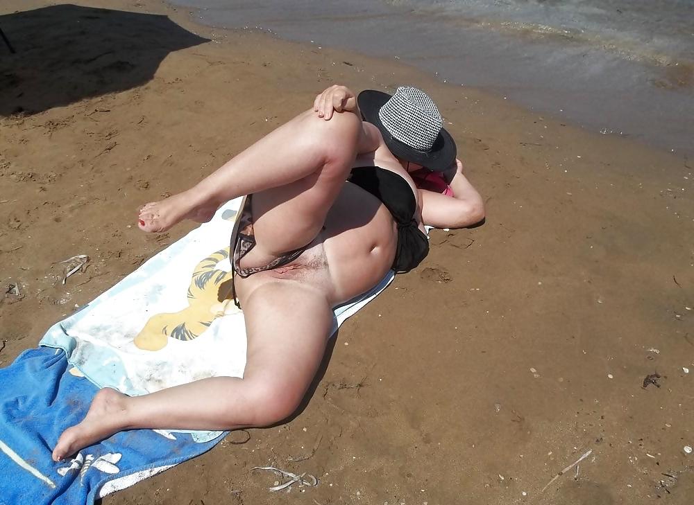 6P Sunbathing nude on the beach