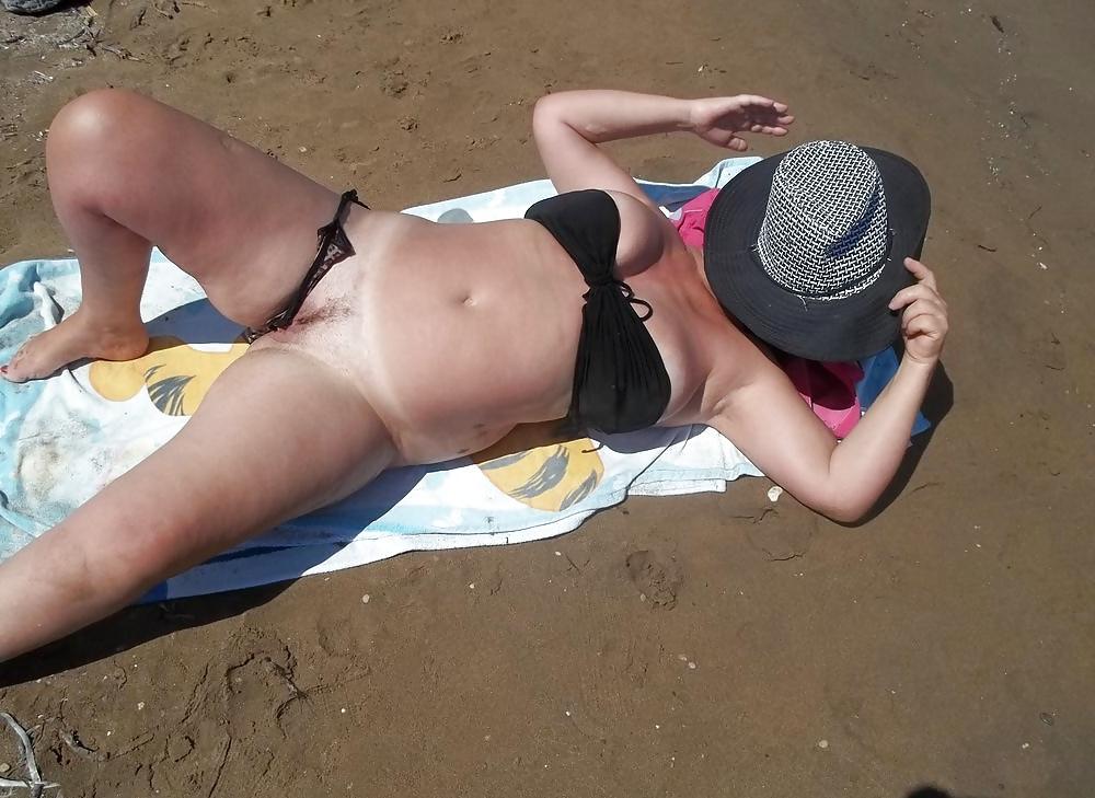 6P Sunbathing nude on the beach