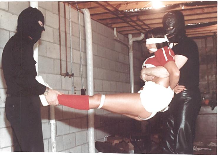 25P Cheerleader wearing white panties stripped and bound.