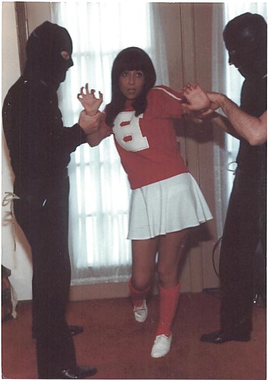 25P Cheerleader wearing white panties stripped and bound.