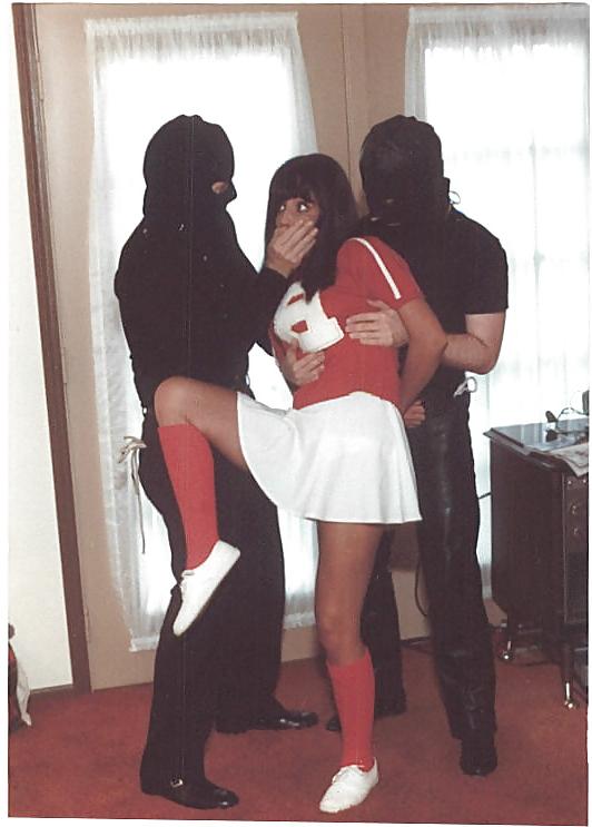 25P Cheerleader wearing white panties stripped and bound.