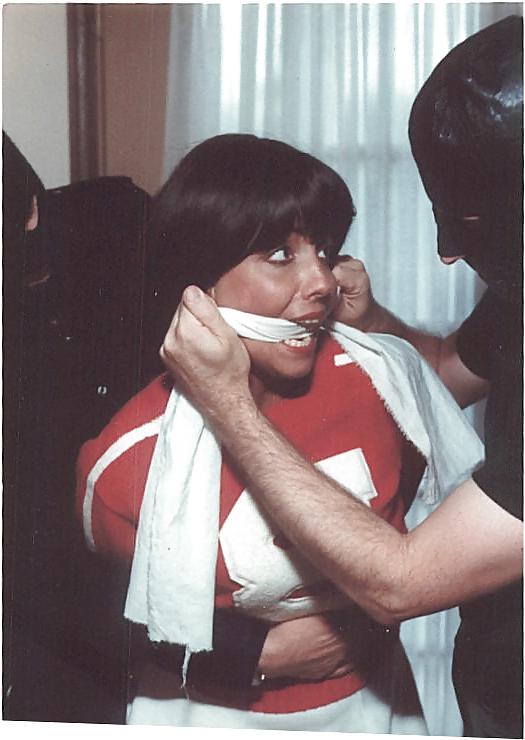 25P Cheerleader wearing white panties stripped and bound.