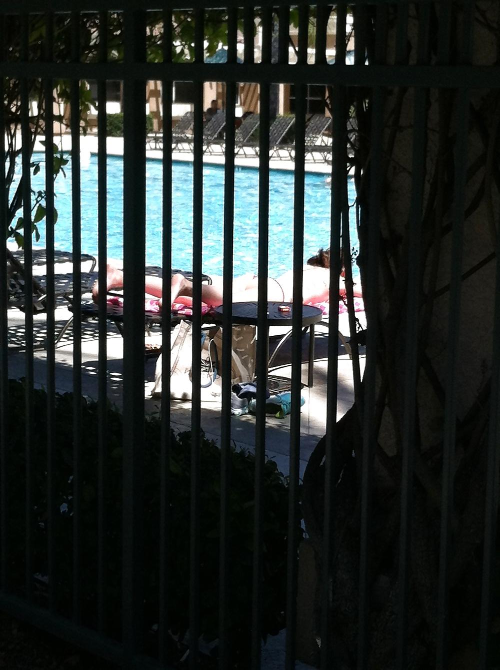 9P Hot girl tanning by the pool