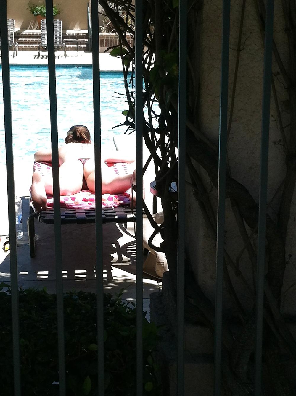 9P Hot girl tanning by the pool