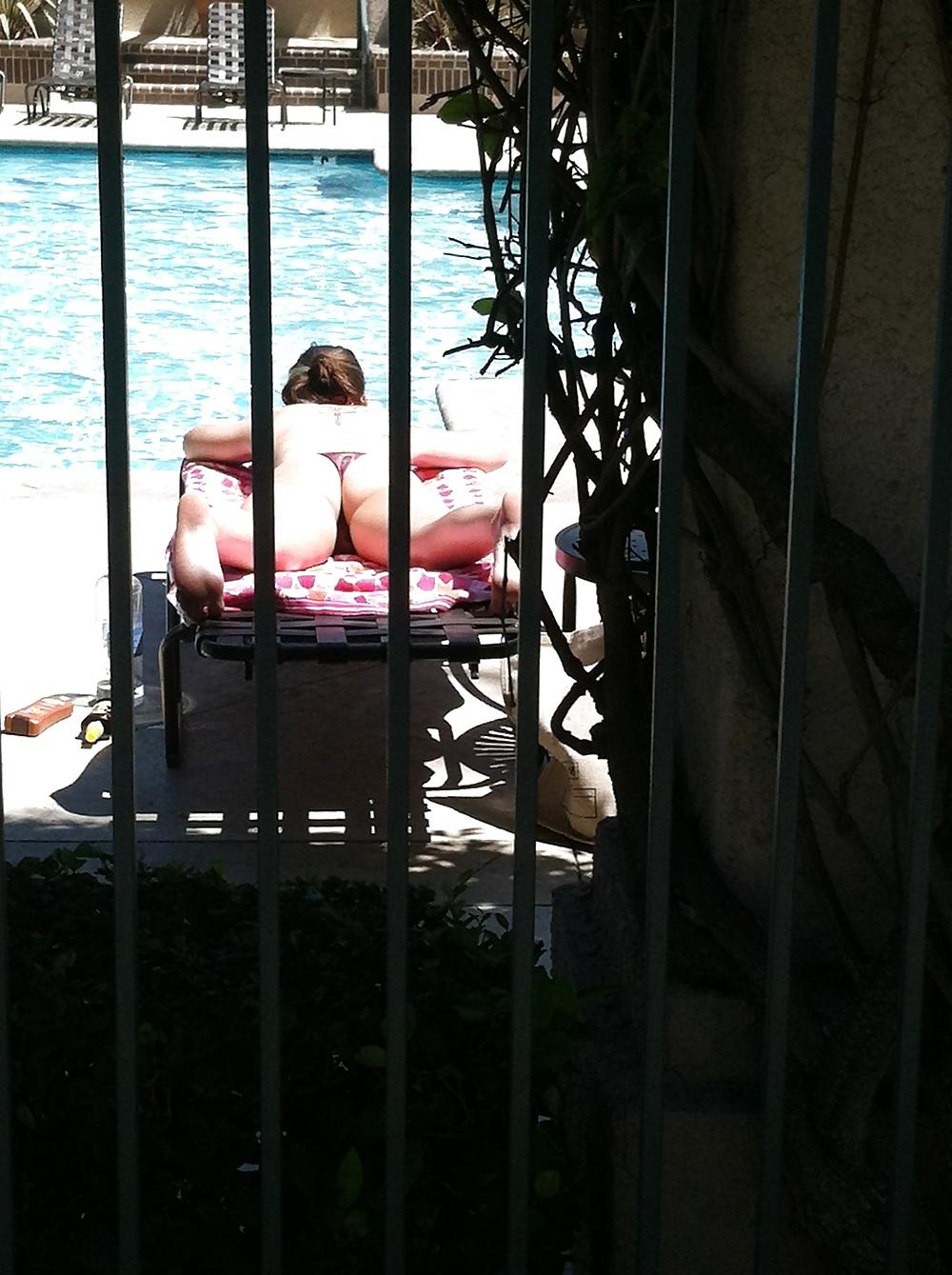 9P Hot girl tanning by the pool