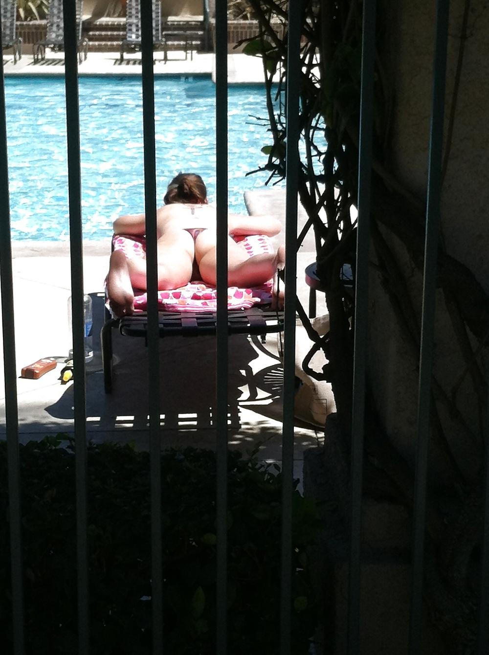 9P Hot girl tanning by the pool