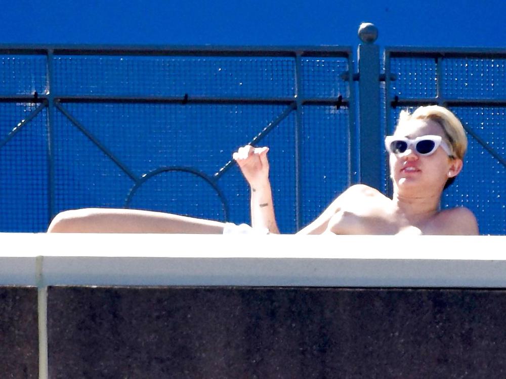 10P Miley Cyrus Topless Sunbathing 