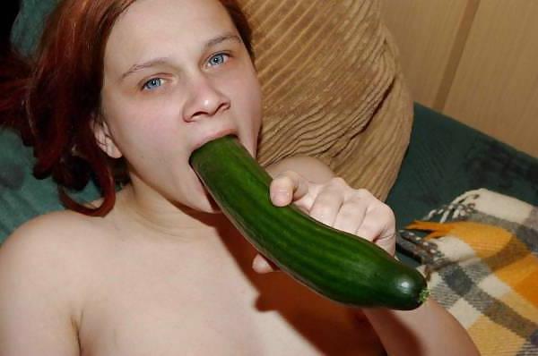 14P Slut plays with a cucumber