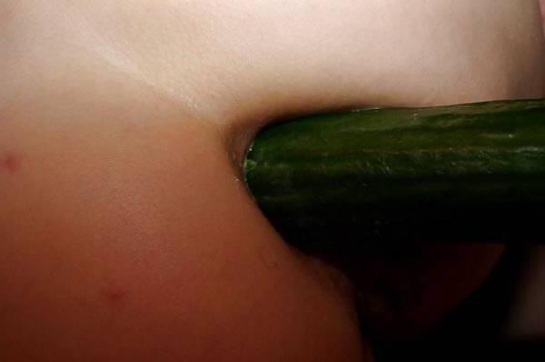 14P Slut plays with a cucumber