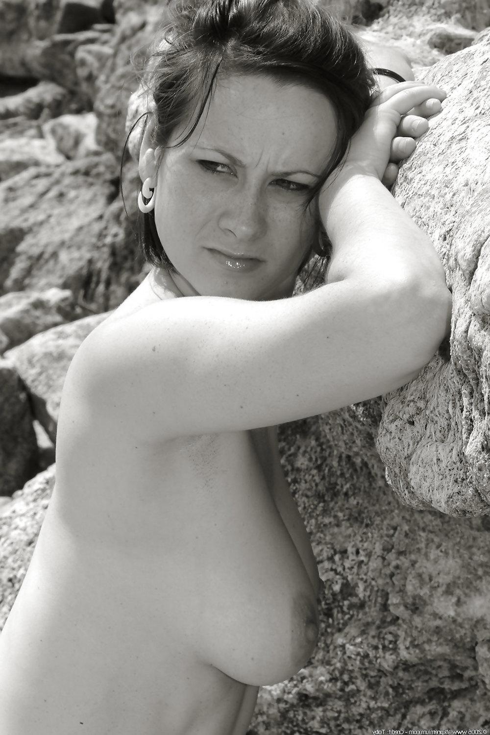 25P Young girl posing at beach - black and white