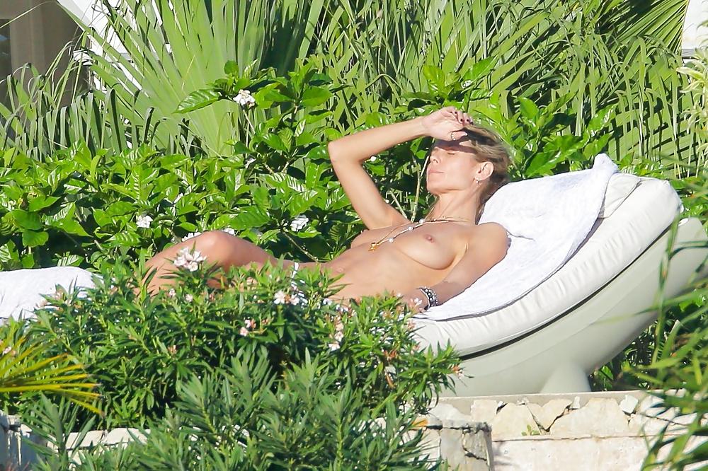 21P Heidi Klum topless at a beach in St Barts