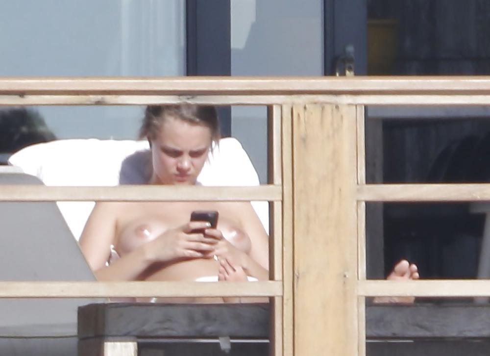 12P Cara Delevingne Sunbathing Topless