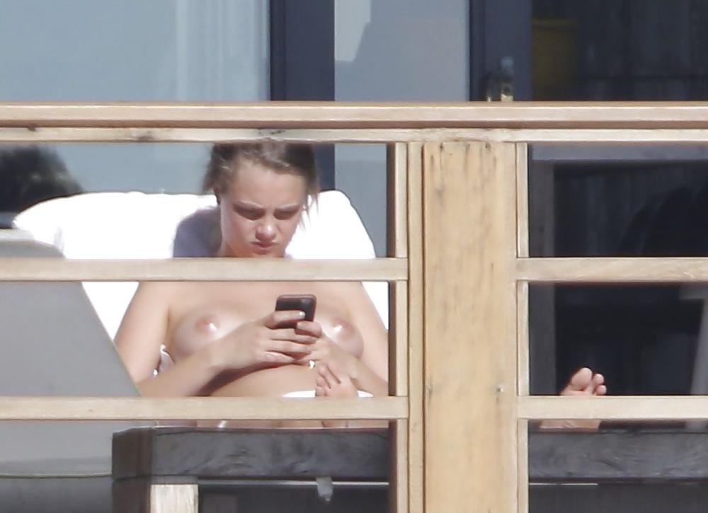 12P Cara Delevingne Sunbathing Topless