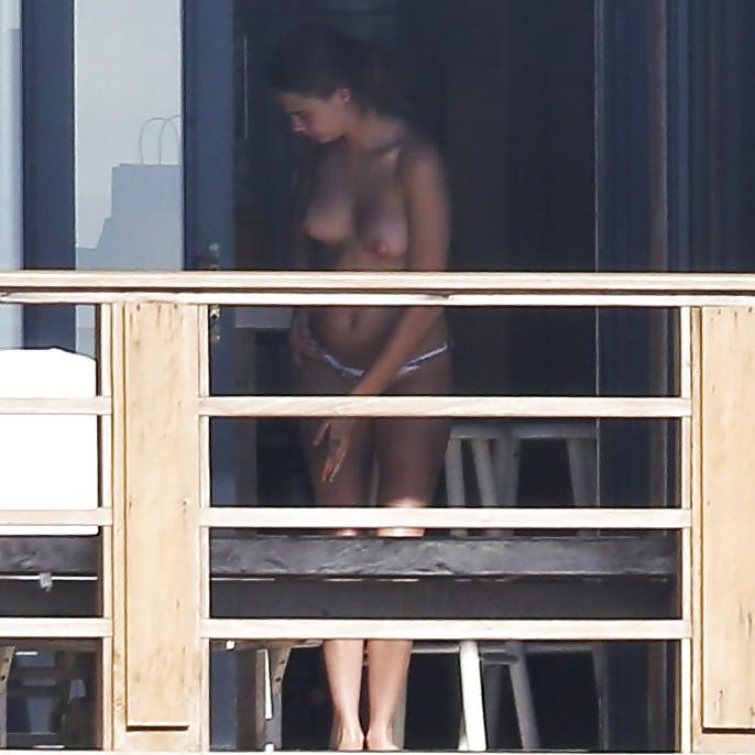 12P Cara Delevingne Sunbathing Topless