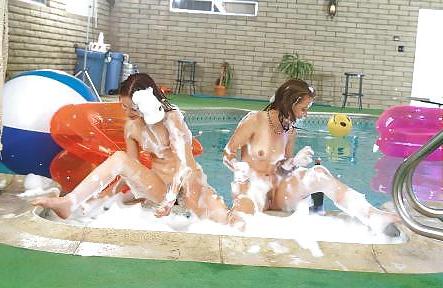25P Two teenie girls in a soapy pool