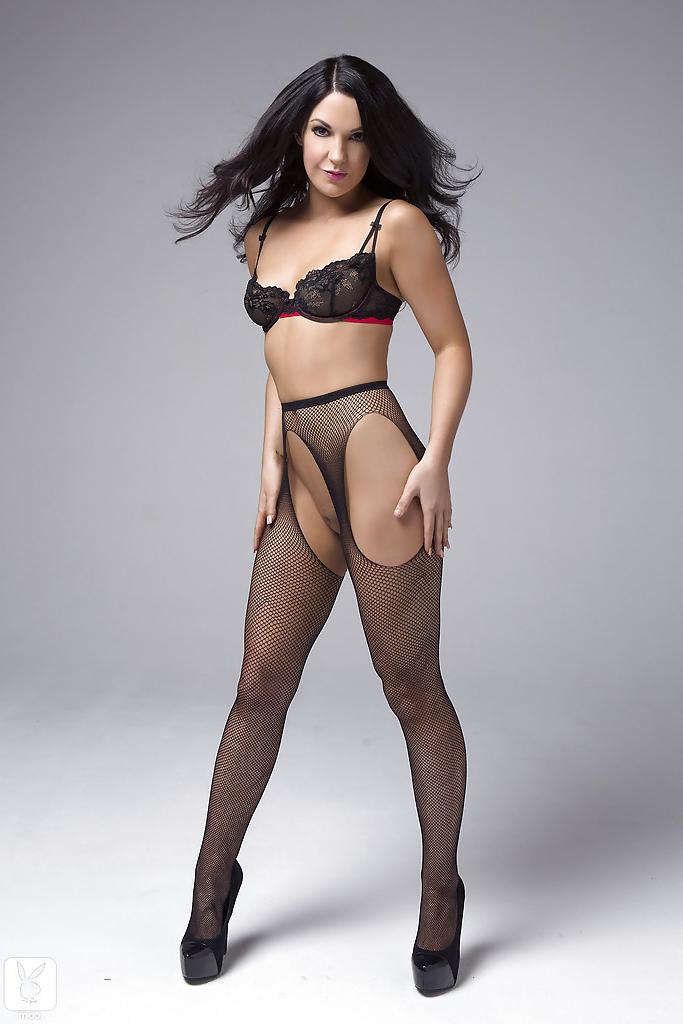 16P Wooing brunette in sexy pantyhose taking off her lacy lingerie top