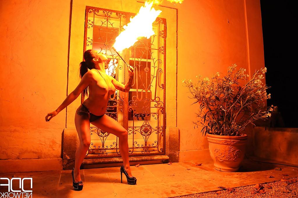 16P European fire breather Daniella Mae displaying big tits and pierced nipples