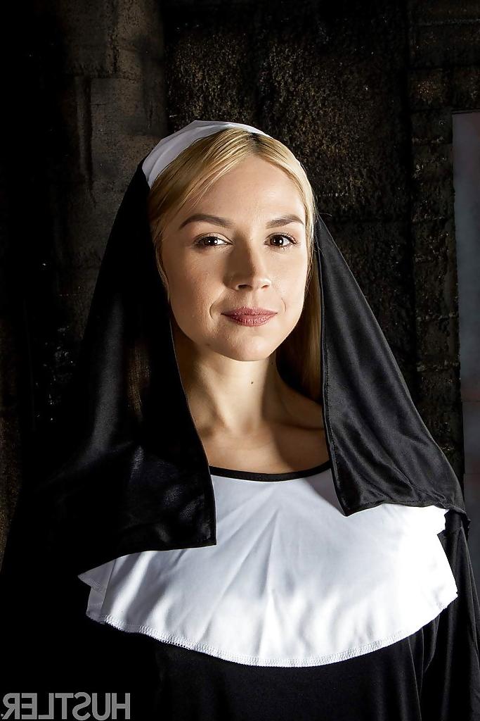 16P Blonde babe Sara Sloane strips off nun's uniform to expose big tits