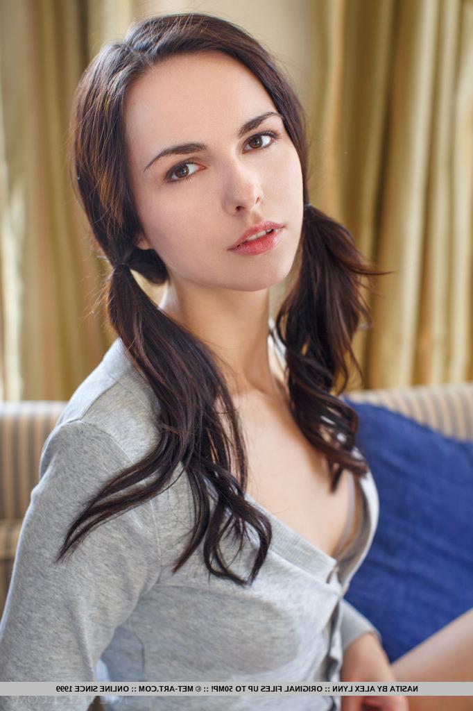 18P Skinny babe unveiling big natural teen tits in pigtails for glamour pics