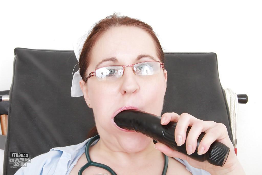 16P Naughty mature nurse in stockings stuffing her twat with dildo and gyno tool