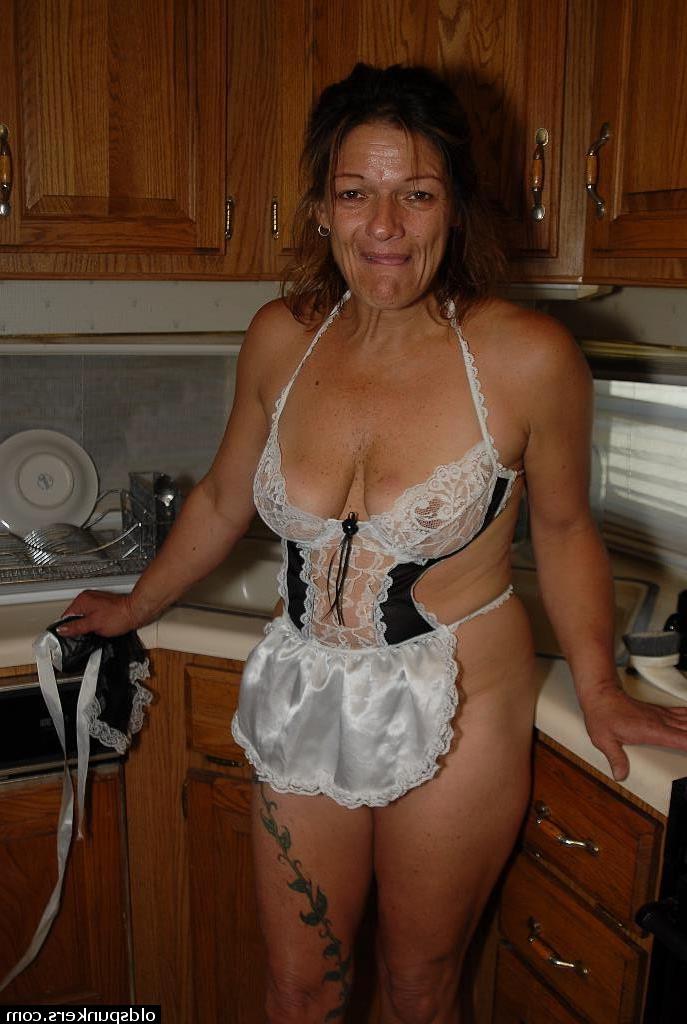 16P Experienced blonde lady Ivee showing off thong adorned butt in kitchen