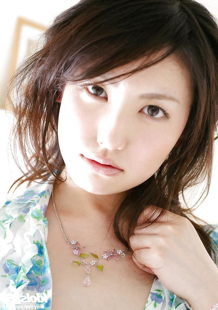 15P Sweet asian babe Takako Kitahara stripping and posing on the bed