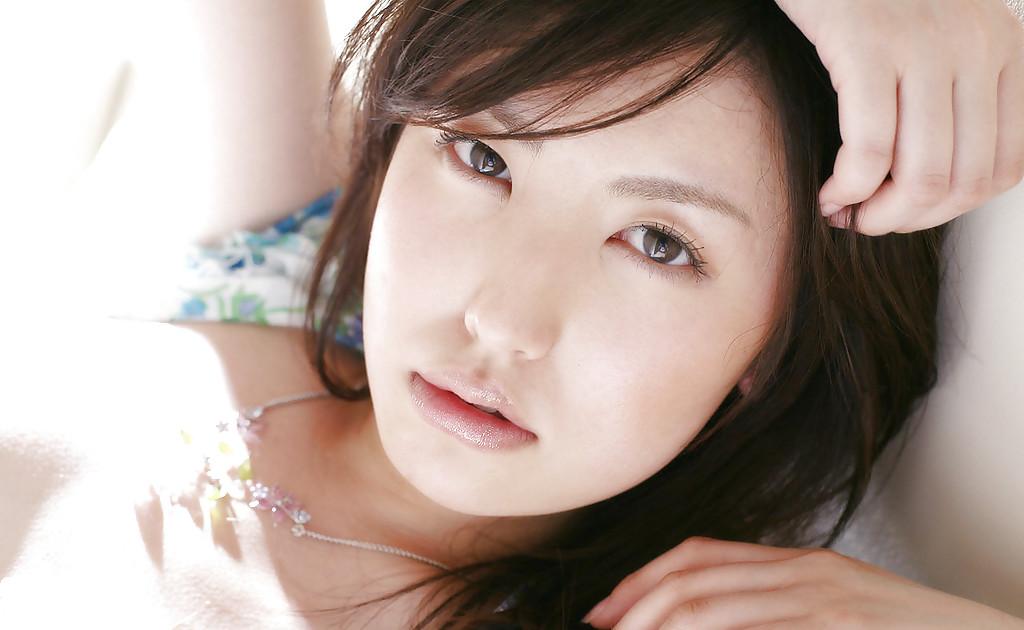 15P Sweet asian babe Takako Kitahara stripping and posing on the bed