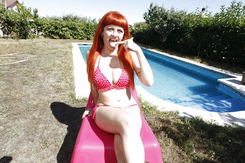 16P Redhead Latina plays with her tits and strips off her bikini by the pool