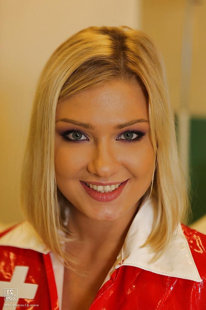 16P Smiley european nurse in latex uniform revealing her tits and teasing her slit